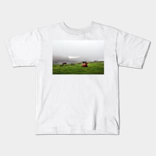 Highland cattle grazing on the misty coast of Islay, Scotland Kids T-Shirt